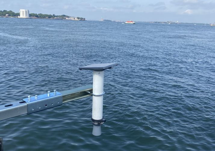 Hohonu solar powered water level sensor across the harbor from Monitor One tide sensor